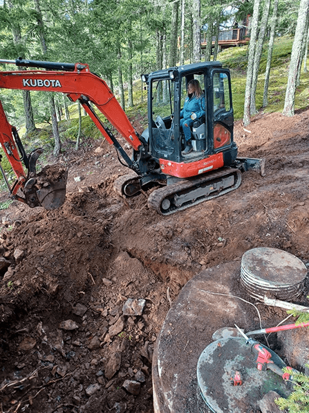 Jennifer working the excavator